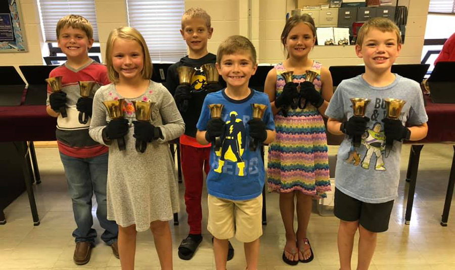 Group of children practicing with bells